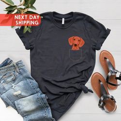 dachshund dog with middle finger in the pocket funny t-shirt, pocket s