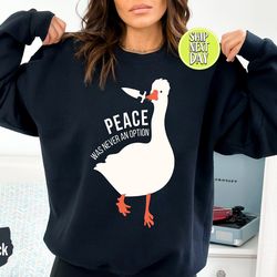 murder duck crewneck sweatshirt, untitled duck game, duck with knife meme shirt, funny goose sweatshirt, peace was never