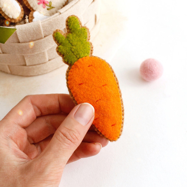 Felt Easter carrot cookie in the authors hand