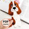 DIY felt hand sewn craft - kids long Basset hound bookmark in authors hand in front of the opened book