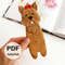 DIY felt hand sewn craft - kids long Yorkshire terrier dog hound bookmark in authors hand in front of the opened book