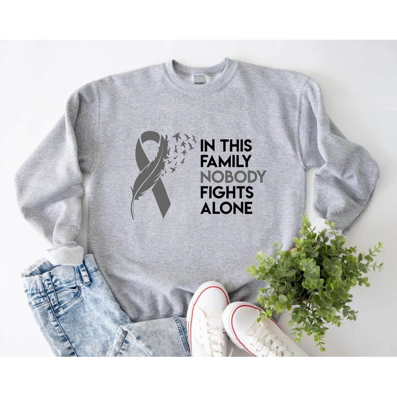 In This Family Nobody Fights Alone Sweatshirt, Cancer Awareness Sweater, Brain Cancer Ribbon, Support Squad, Brain Cancer Survivor Gift.jpg
