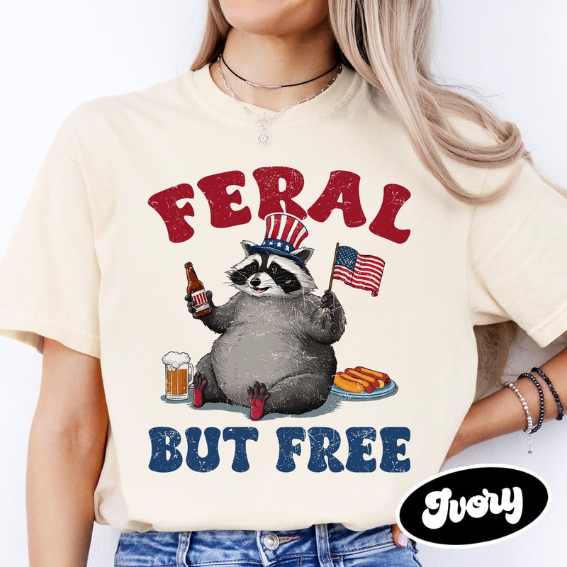 Funny Raccoon 4th Of July Shirt, Feral But Free T-Shirt, Independence Day Tee, Patriotism Shirt, 1776 Shirt, USA Shirt, American Flag Shirt.jpg