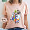 This Is How I Roll Pride Shirt, LGBTQIA Library T-Shirt, Queer Bookish Apparel, Librarian Gift, Pride Month Shirt, Pride Reading Shirt.jpg