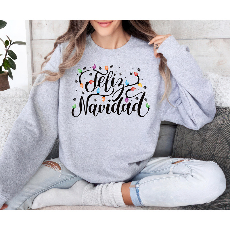 Feliz Navidad Sweatshirt, Merry Christmas Unisex Sweatshirt, Spanish Family Sweater, Christmas Matching Sweatshirt, Christmas Lights Shirt 1.jpg