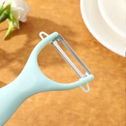 stainless steel vegetable peeler with easy grip handle for potatoes fruits and kitchen prep