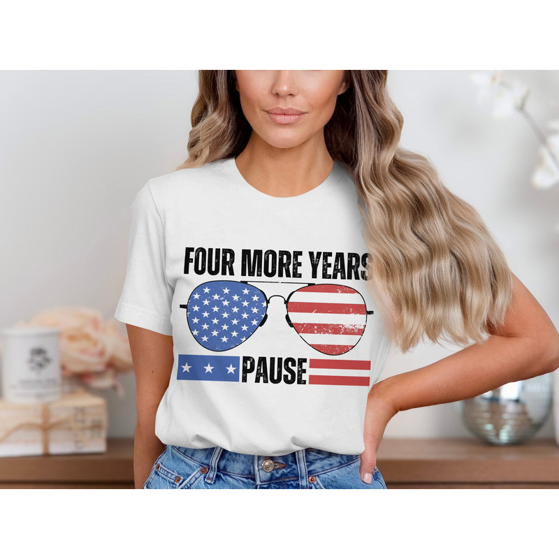 Four More Years Pause Patriotic Sunglass Graphic T-Shirt, American Flag Inspired Design, Distressed Look, Trendy Tee for All Seasons.jpg