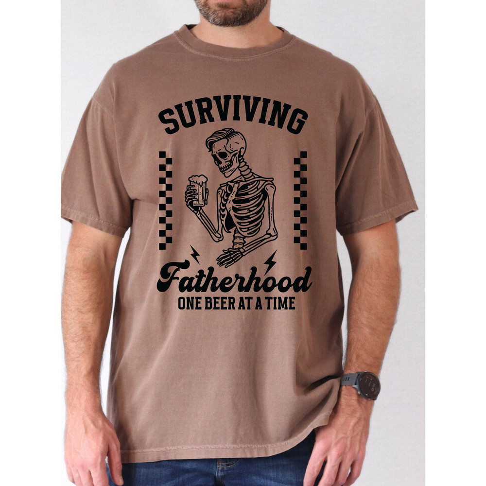 Funny Dad Shirt- Surviving Fatherhood One Beer at a Time Comfort Colors Tee-Trendy Father's Day Gift- Grunge Skeleton Graphic Tee.jpg