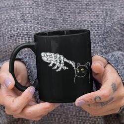 black cat mug, funny halloween gift, spooky season drinkware, cute skeleton coffee cup