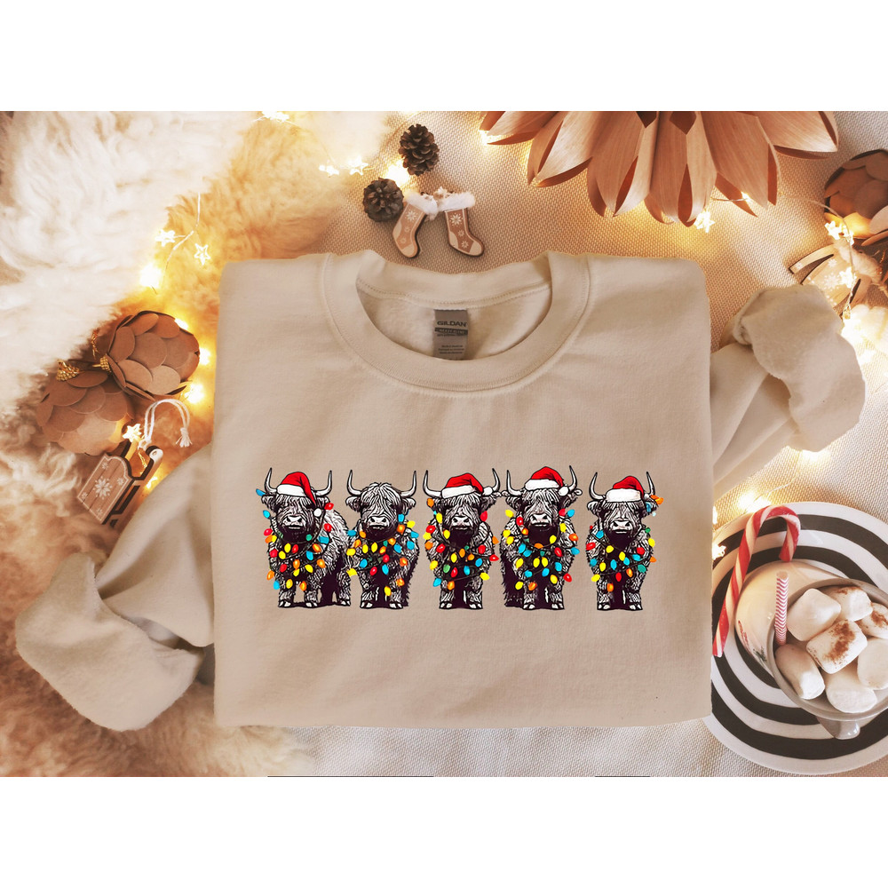 Christmas Cows Sweatshirt, Cow Lights Sweater, Cow Women Sweatshirt, Highland Cow Crewneck, Farm Animal Shirt, Christmas Sweatshirt.jpg