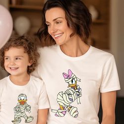 donald duck and daisy duck halloween shirt, disney halloween couple shirts, disney trip shirt, spooky shirt, mummy shirt