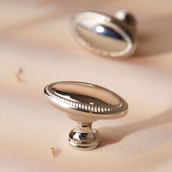 bright nickel oval brass cabinet knob with beaded edge