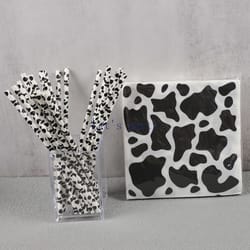 black & white cow theme party supplies with paper napkins & straws for birthdays & baby showers