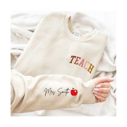 customize apple teacher last name on sleeve sweatshirt, apple teach sweatshirt, back to school, team teacher sweatshirt,