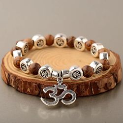 handcrafted natural wood bead bracelets with om pendant for women and men - yoga meditation prayer jewelry