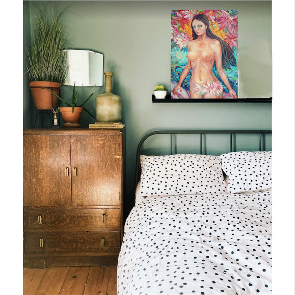 Painting of a naked woman hanging in the interior above the bed.png
