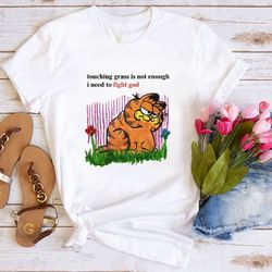 touching grass is not enough i need to fight god shirt, touching grass t-shirt, garfield cat sweater, garfield shirt