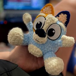 Handmade toy of a small dog resembling Bluey and Bingo's little brother. Perfect for fans of the popular animated series