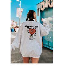 progress over perfection sweater, trendy clothing, retro style