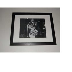 framed ac/dc bon scott, angus young on shoulders,