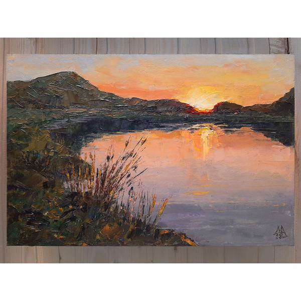 Red sunset Landscape includes images of hills with high grasses calm lake and warm sunlight.