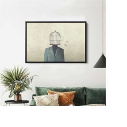 man with open birdcage over his head, birdcage wall art, freedom wall art, surreal canvas, black frame canvas, abstract