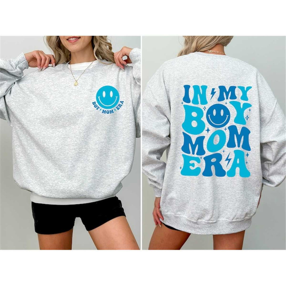 MR-232202417473-a-woman-wearing-a-sweatshirt-that-says-in-my-boy-mom-era.jpg