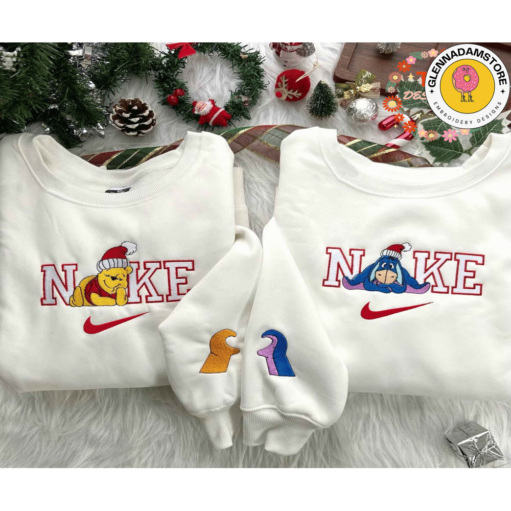 Winnie The Pooh Couple Christmas Nike Embroidered Sweatshirt ,Christmas Gift For Couple, Christmas Nike Couple Embroider.png