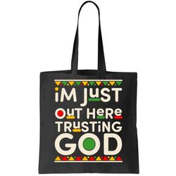im just out here trusting god traditional colors tote bag
