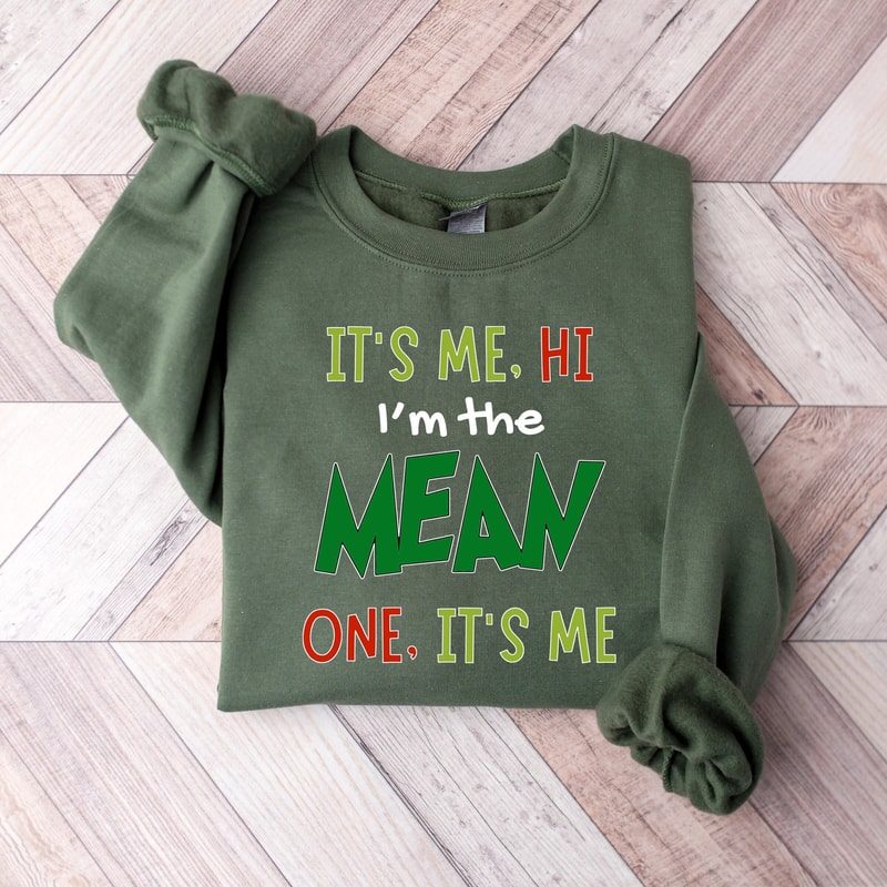 It's Me Hi I'm The Mean One It's Me Hi Christmas Sweatshirt,Girls Concert Shirt,Trendy Xmas Party Outfit,Gift for Birthday Girls,Party Crew.jpg