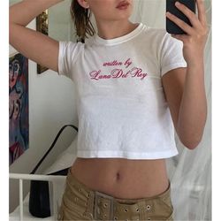 written by lana del rey, baby girl tee top y2k clothing pop culture t shirt y2k slogan tee indie kid top kawaii baby tee