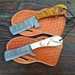 precision-crafted high-grade damascus steel blade., fixed blade bushcraft knife with walnut wood handle.