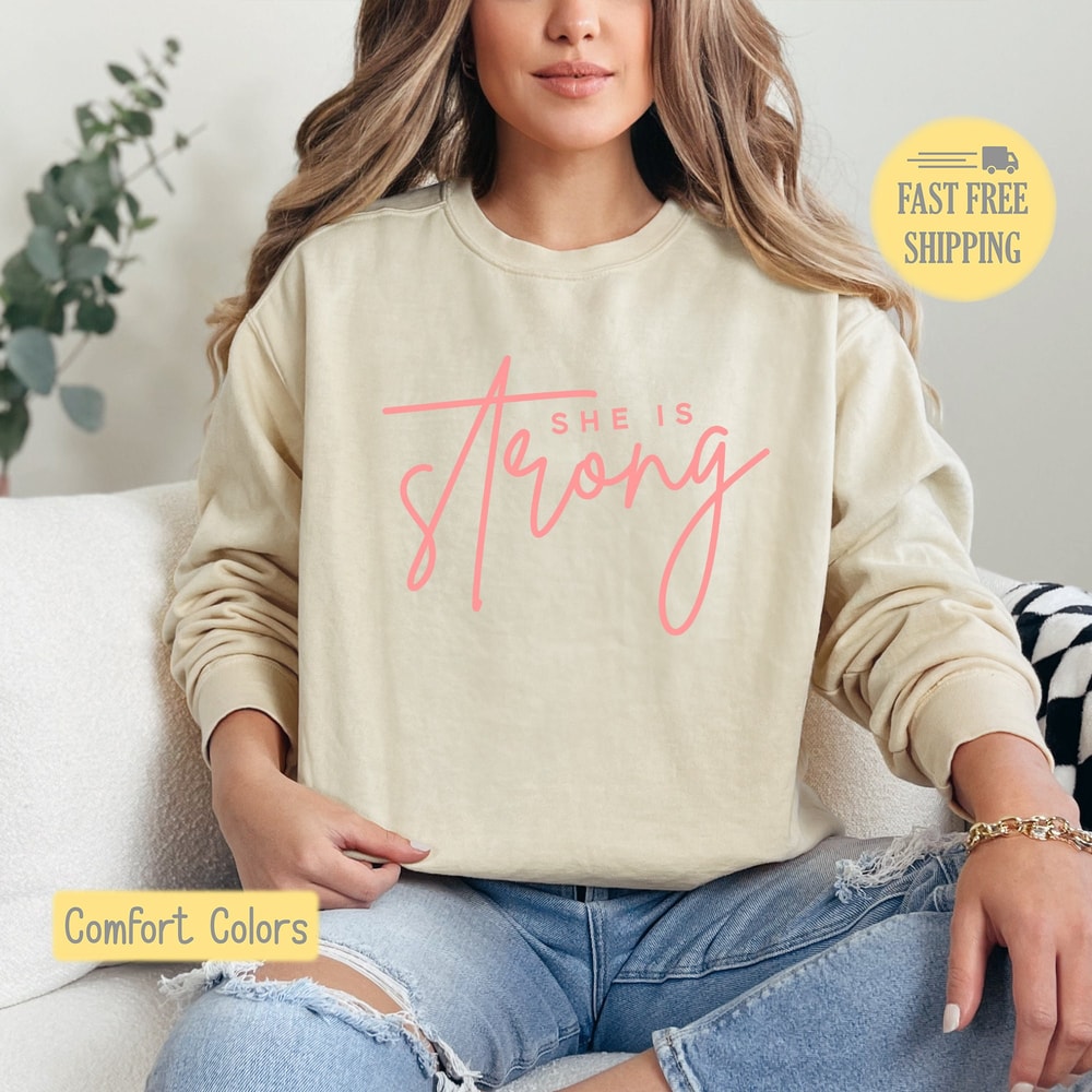 She is Strong Sweatshirt, Strong Woman Shirt, Women Power Tshirt, Girl Strength Tee Shirt, Gift for Her, Comfort Colors, Trending Now.jpg