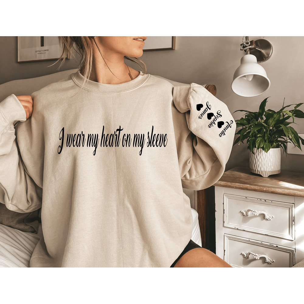 I Wear My Heart On My Sleeve Sweatshirt, Mothers Day Shirt, Mama Sweatshirt with Kids Name on Sleeve, Personalized Mother Day Gift for Mom.jpg