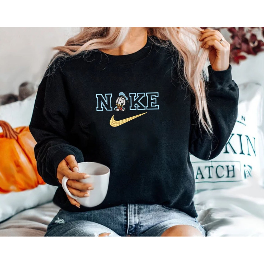 Disney Donald Duck Nike Logo Embroidered Sweatshirt, Disney Movie Embroidered T-shirt, Disney Movie Embroidery Polo Shirt.jpg