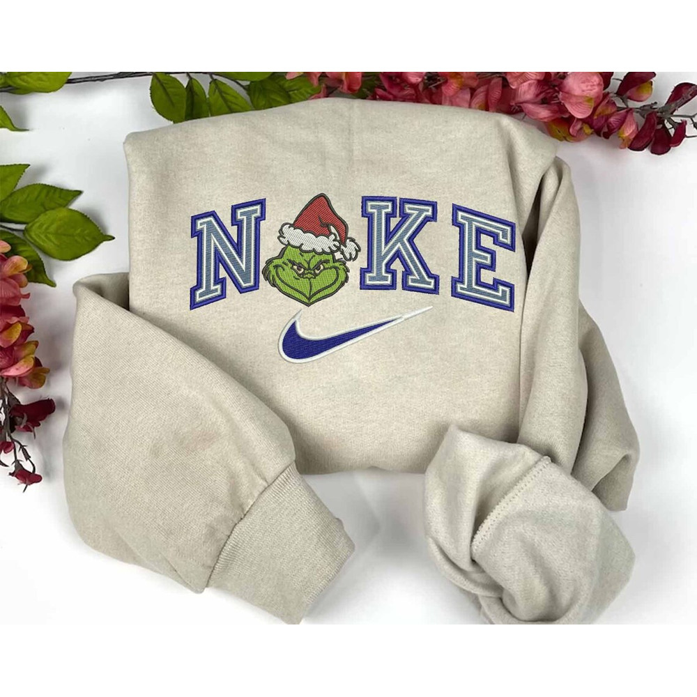 Happy Grinch Face Blue Nike Embroidered Sweatshirt Christmas Xmas.jpg