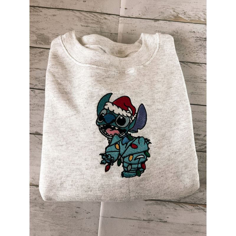 Santa Stitch With Christmas Lights Disney Embroidered Sweatshirt Inspired Crewneck Sweatshirt Christmas Xmas.jpg