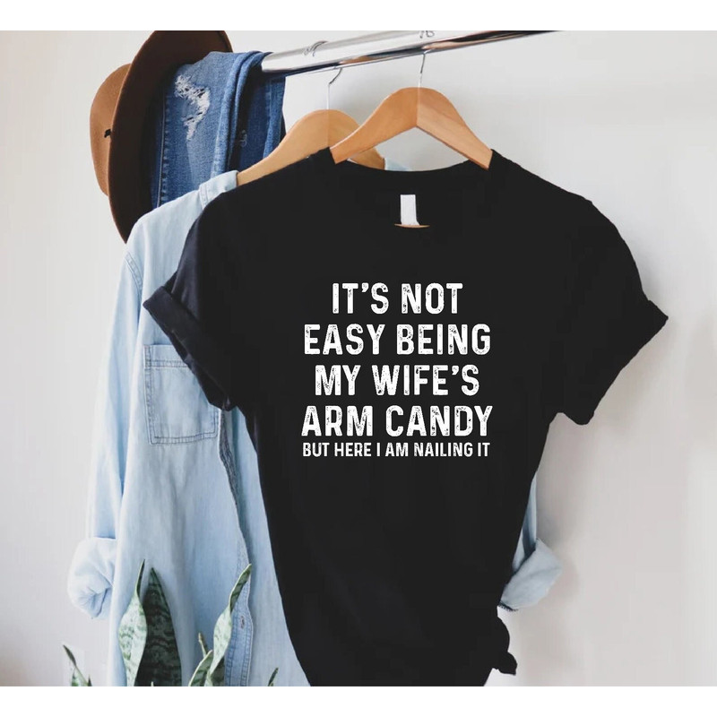 Funny Husband Shirt,Anniversary Gift,Funny Shirt Men,Husband Gift,Fathers Day Tee,It's Not Easy Being My Wife's Arm Candy,Dad Tee,Pops Shirt.jpg