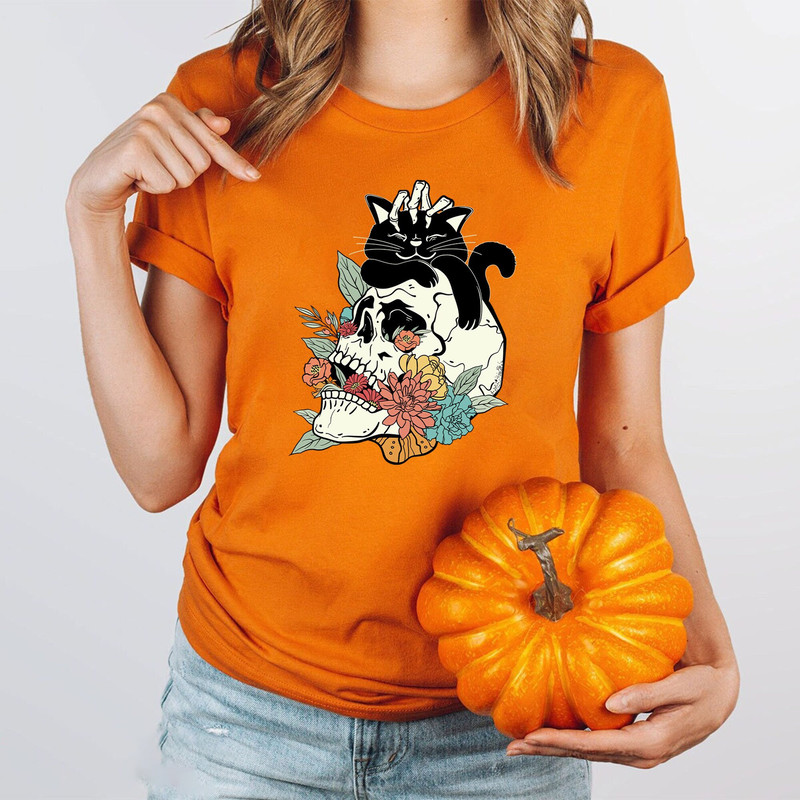 Black Cat on Skull shirt, Skull And Black Cat Shirt, Shirt For Fall, Halloween Black Cat T-shirt, Halloween Black Cat Design, Fall T-shirt.jpg