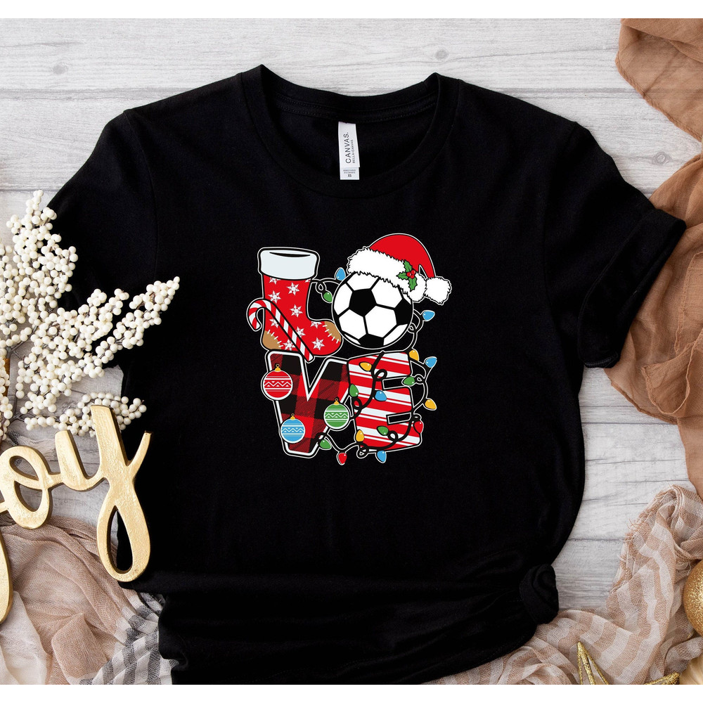 Love Soccer Ball Wearing Santa Hat Shirt, Christmas Gift, Santa Claus Graphic Tee, December 25th, Soccer Lovers Graphic, Soccer Player Shirt.jpg