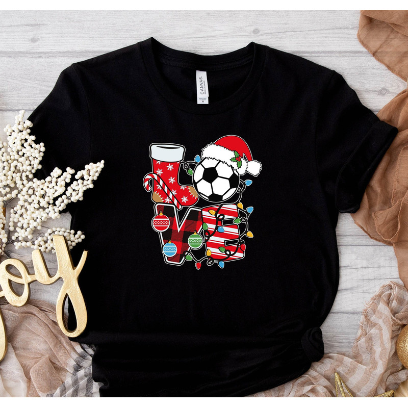 Love Soccer Ball Wearing Santa Hat Shirt, Christmas Gift, Santa Claus Graphic Tee, December 25th, Soccer Lovers Graphic, Soccer Player Shirt.jpg