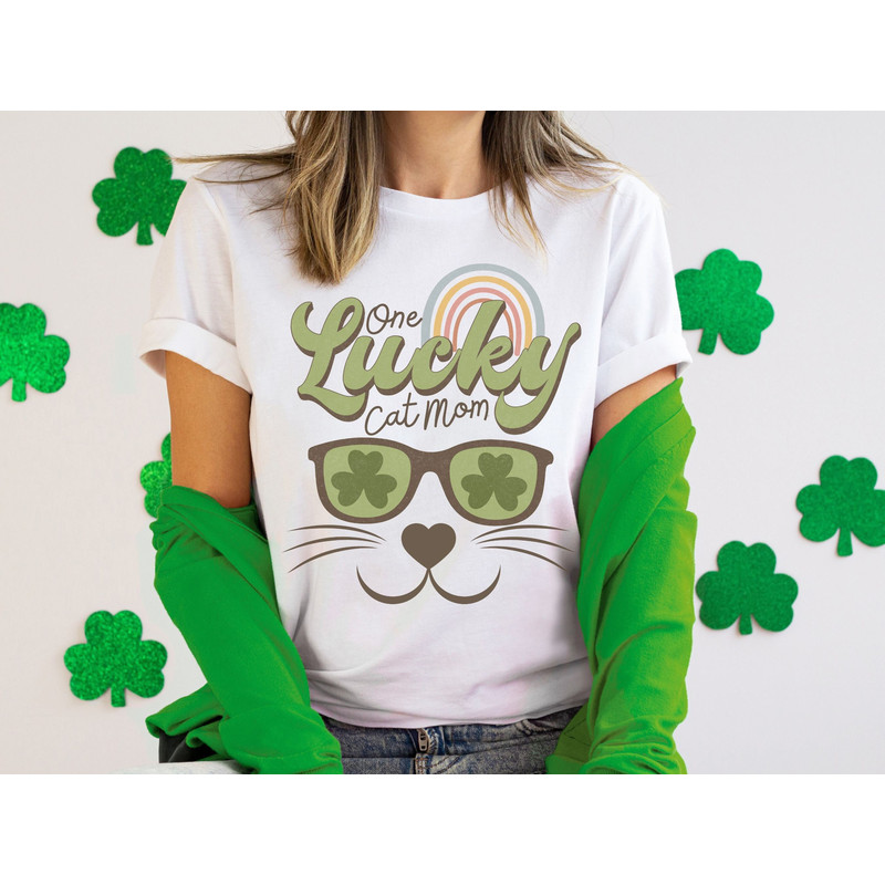 St Patrick's Day Cat Mom Shirt, Cat Themed St Pattys Day Clothing, Cat Face Saint Patricks Day Apparel, One Lucky Cat Mama Shirt, Cat Gifts.jpg