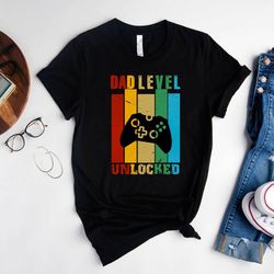dad level unlocked retro shirt, new dad outfits, pregnancy announcement gift tshirt for husband, vintage gamer daddy shi