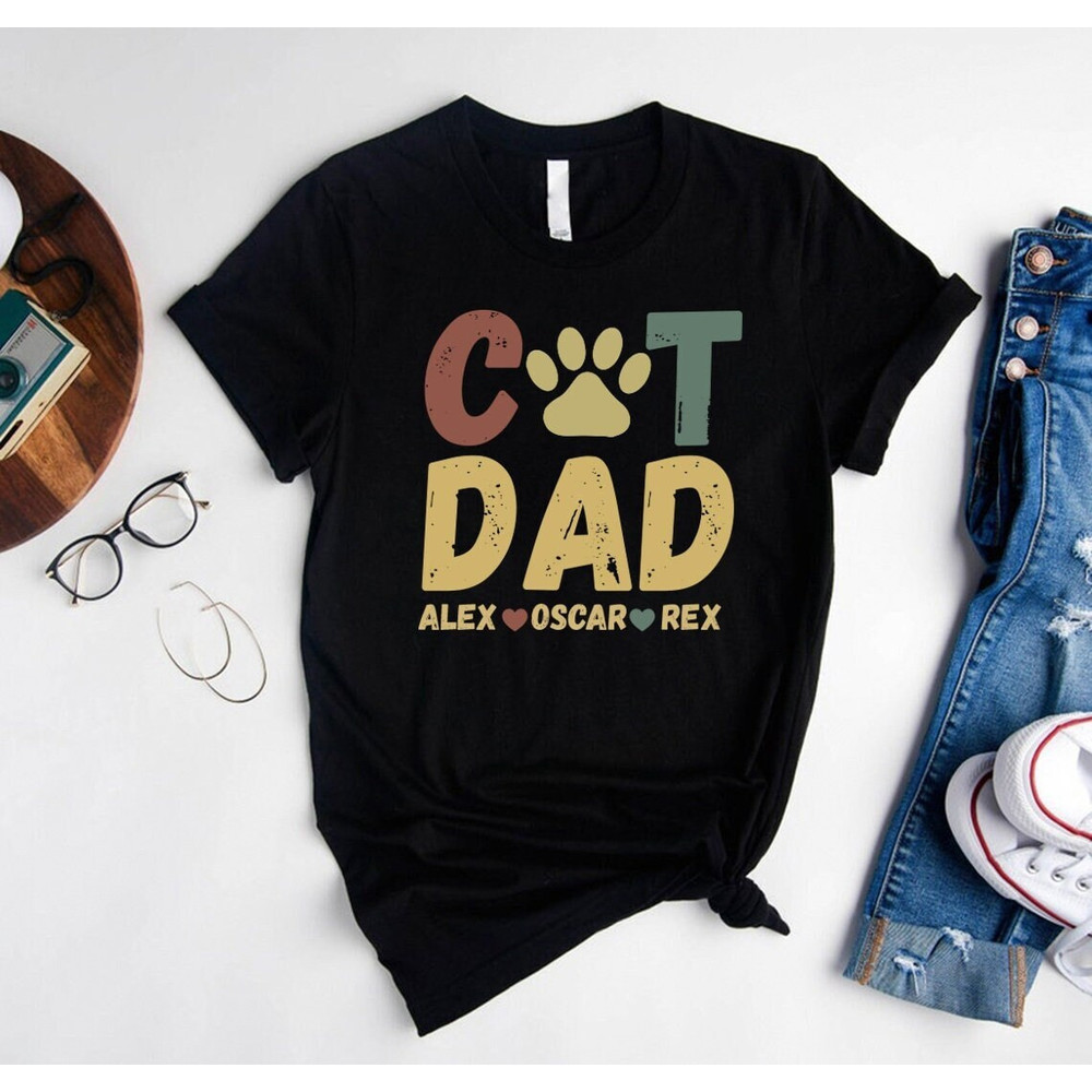 Personalized Cat Dad Shirt,Funny Cat Dad Shirt,Cat Themed Gifts For Men,Custom Cat Dad Shirt With Pet Names,Cat Paw Graphic Tees,Cat Dad Tee.jpg
