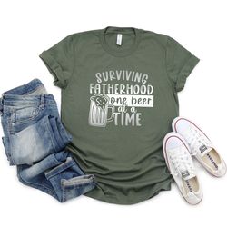 surviving fatherhood one beer at a time shirt, funny fathers day gift, funny dad t shirt, funny t shirt for dad, fathers