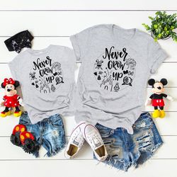 never grow up disney shirt,disney matching shirts for kids,disney never grow up,disney family matching shirts,disney shi