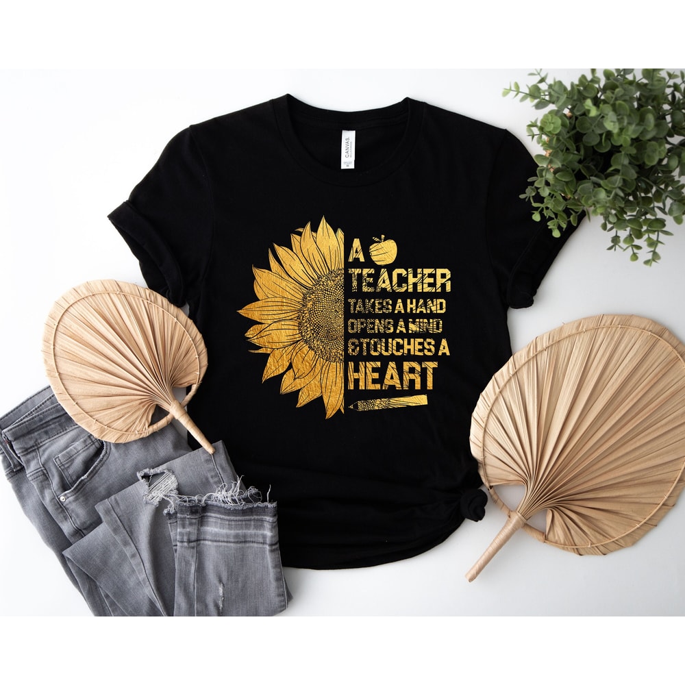 A teacher takes a hand opens a mind and touches a heart shirt, Teacher shirt, teacher sunflower, sunflower shirt, gift for teacher.jpg