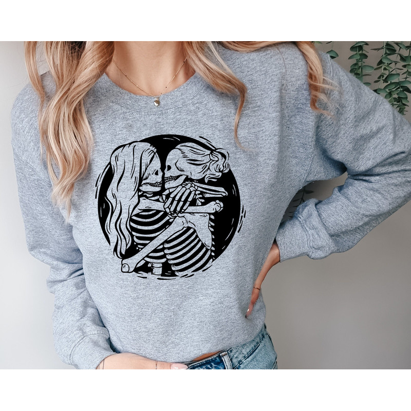 Aesthetic Skeleton Lesbian Couple Sweatshirt, Queer Love Apparel, Lesbian Bridal Party Hoddie, Pride Month Tee, Hugging Skeletons Shirt.jpg