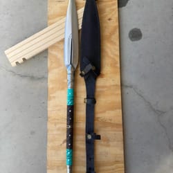 artisan crafted display spear with rosewood finish resin and metal detailing