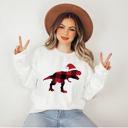 christmas t-rex sweatshirt, buffalo plaid t-rex sweatshirt, trex santa hat hoodie, cute trex christmas sweatshirt, xmas